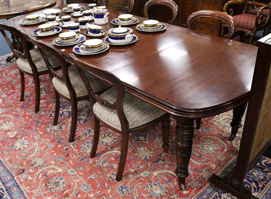 An Edwardian mahogany extending dining table W.270cm. (fully extended)